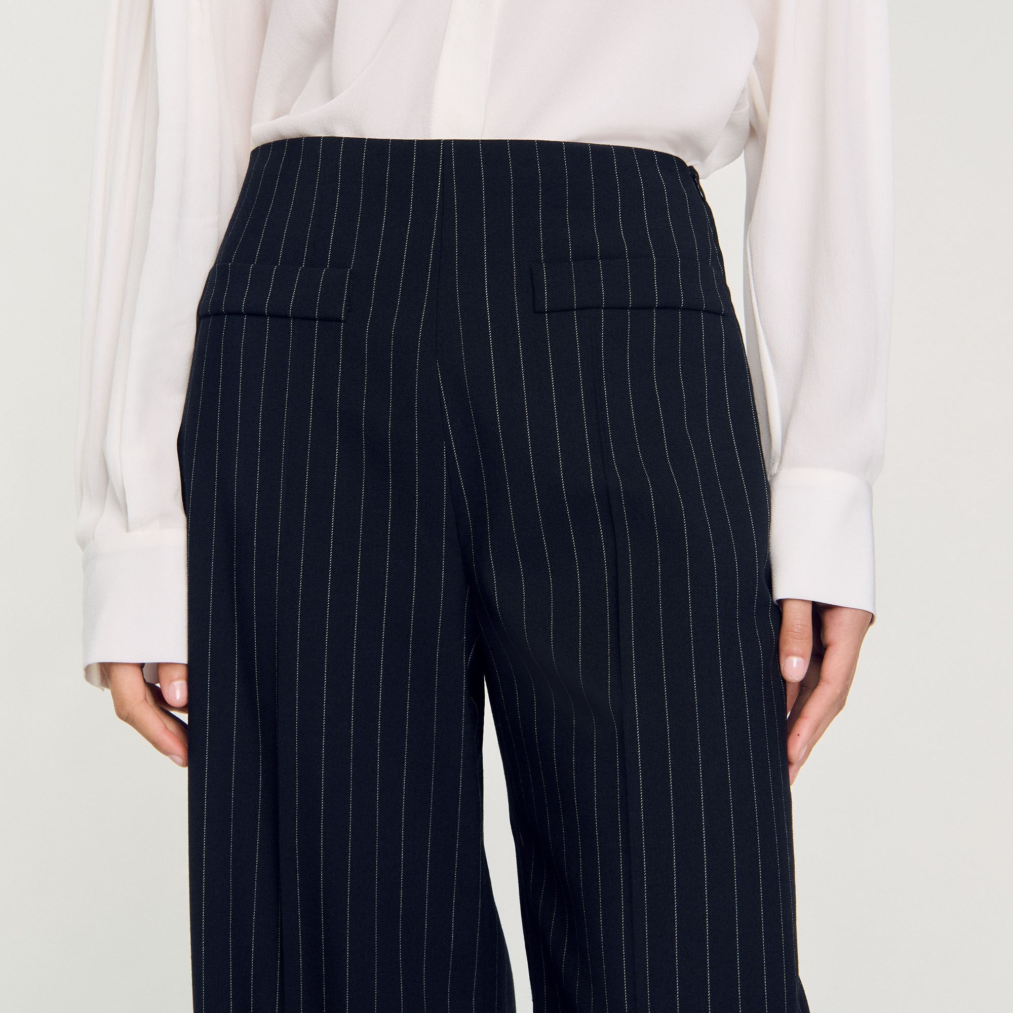 Sandro / Chalk-striped trousers Black