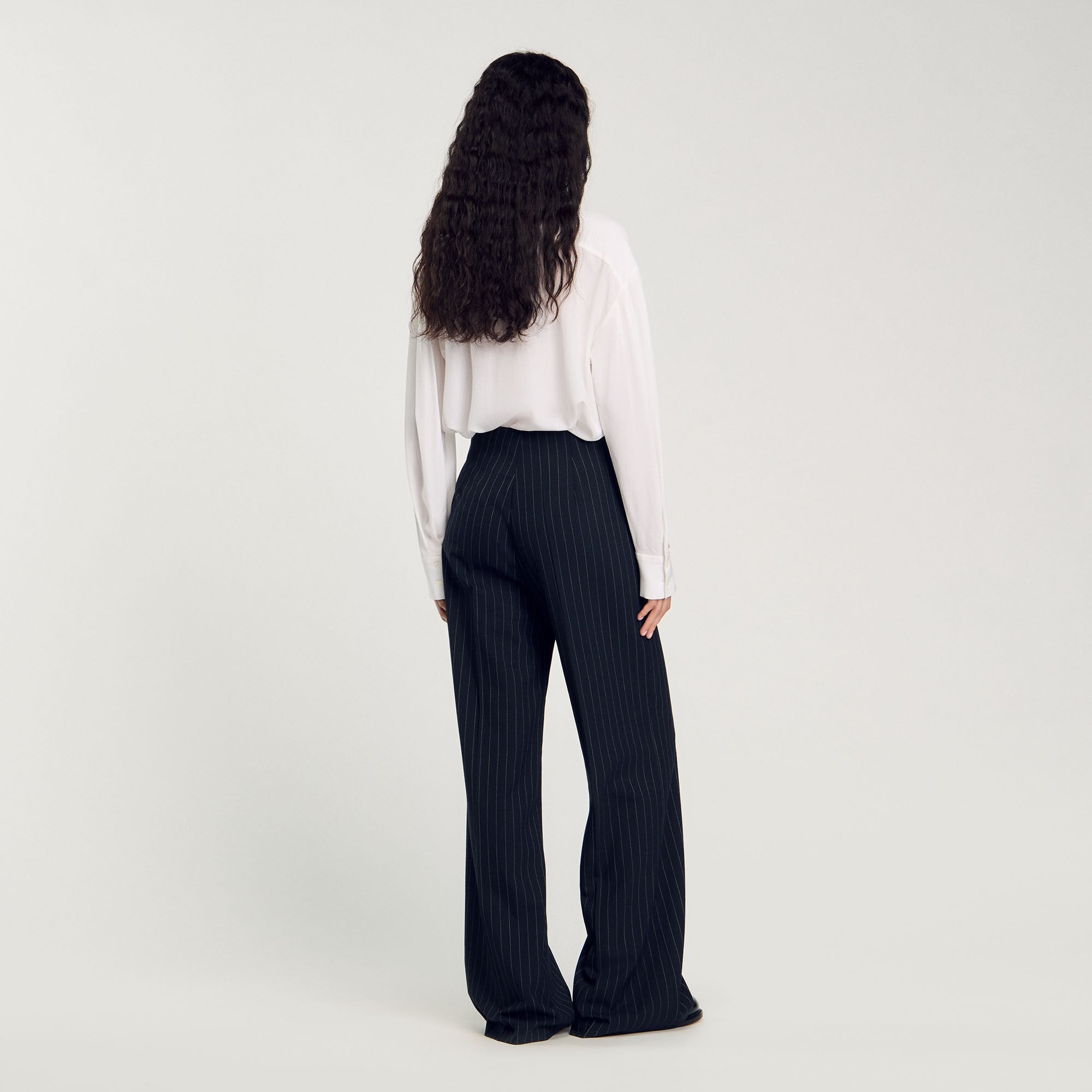 Sandro / Chalk-striped trousers Black
