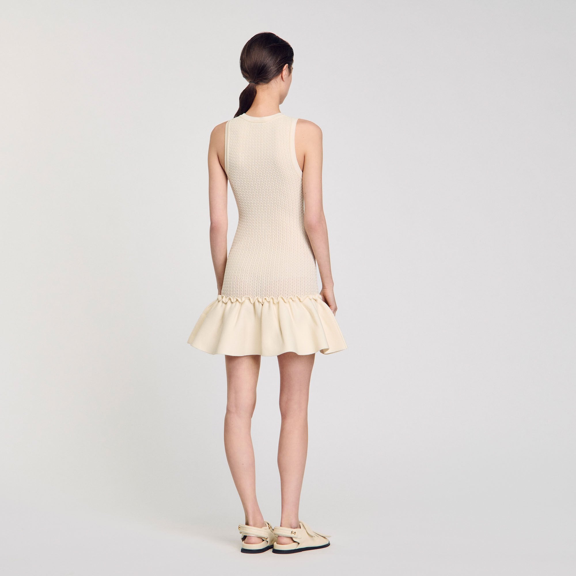 Sandro / Mini knit dress with ruffle Ecru