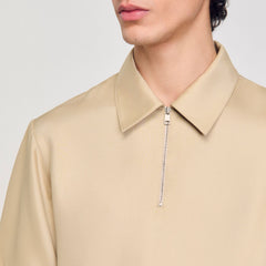 Sandro / Zip-neck polo shirt Sand.
