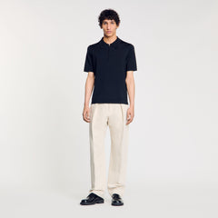 Sandro / Knitted polo shirt with zip collar Fonte