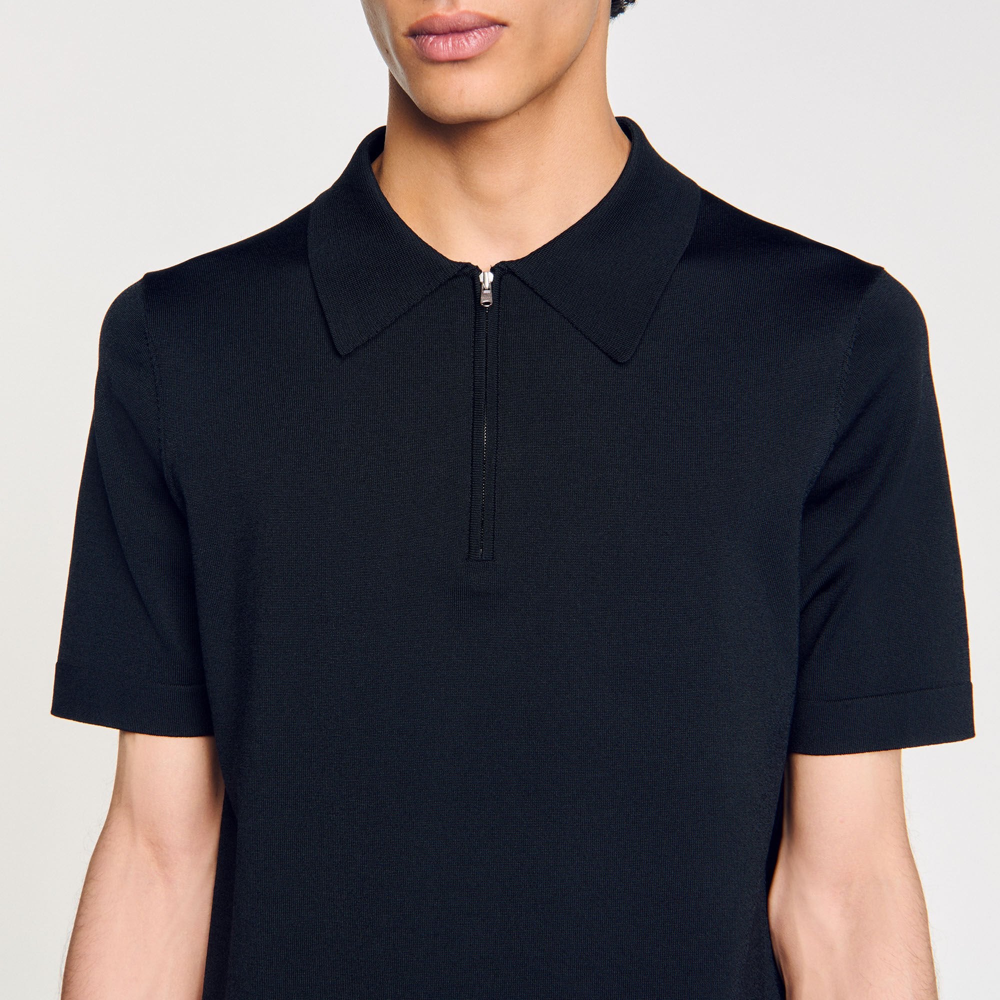 Sandro / Knitted polo shirt with zip collar Fonte